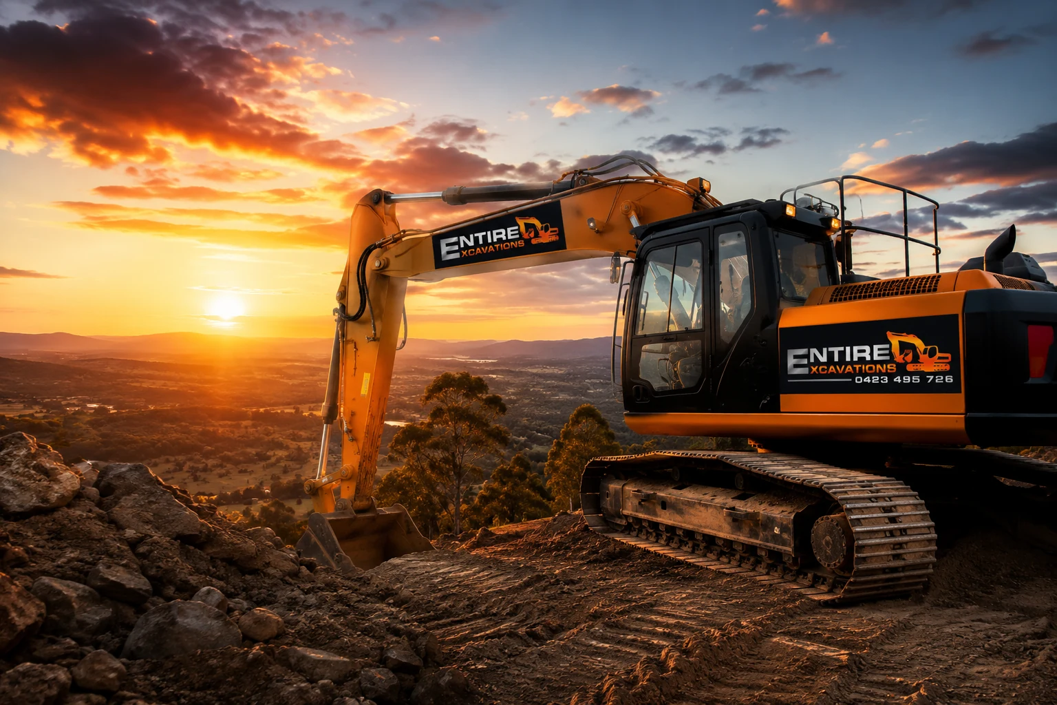 Entire Excavations excavator at sunset
